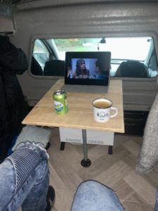 Inside mini camper with movie