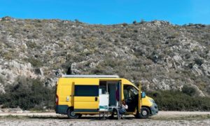 Large yellow van with side sliding door open